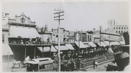 Tribune file photo

A view of Main Street is seen in the 1880s. In the background, the unfinished spires of the Salt lake Temple start to take form.