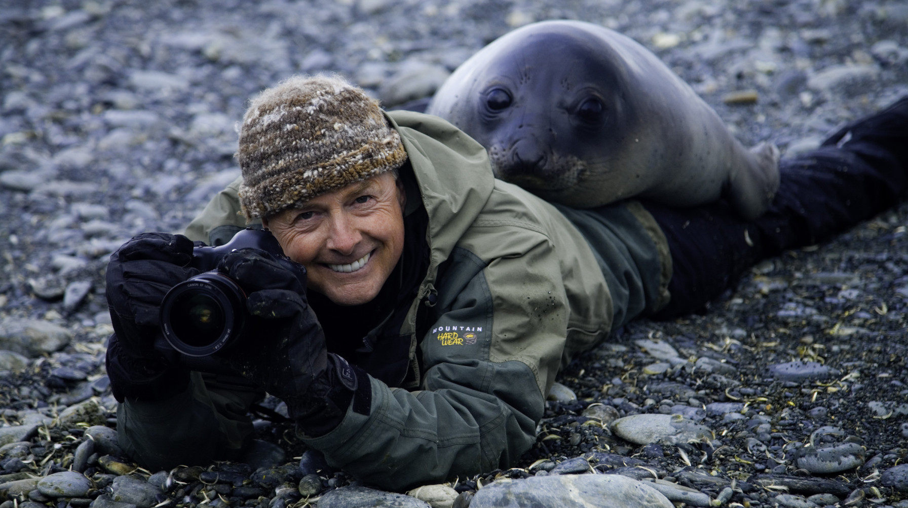 Art wolfe and a Southern elephant seal weaner, South Georgia Island