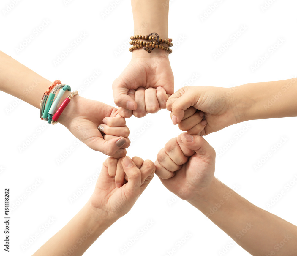 People putting hands together as symbol of unity on white background