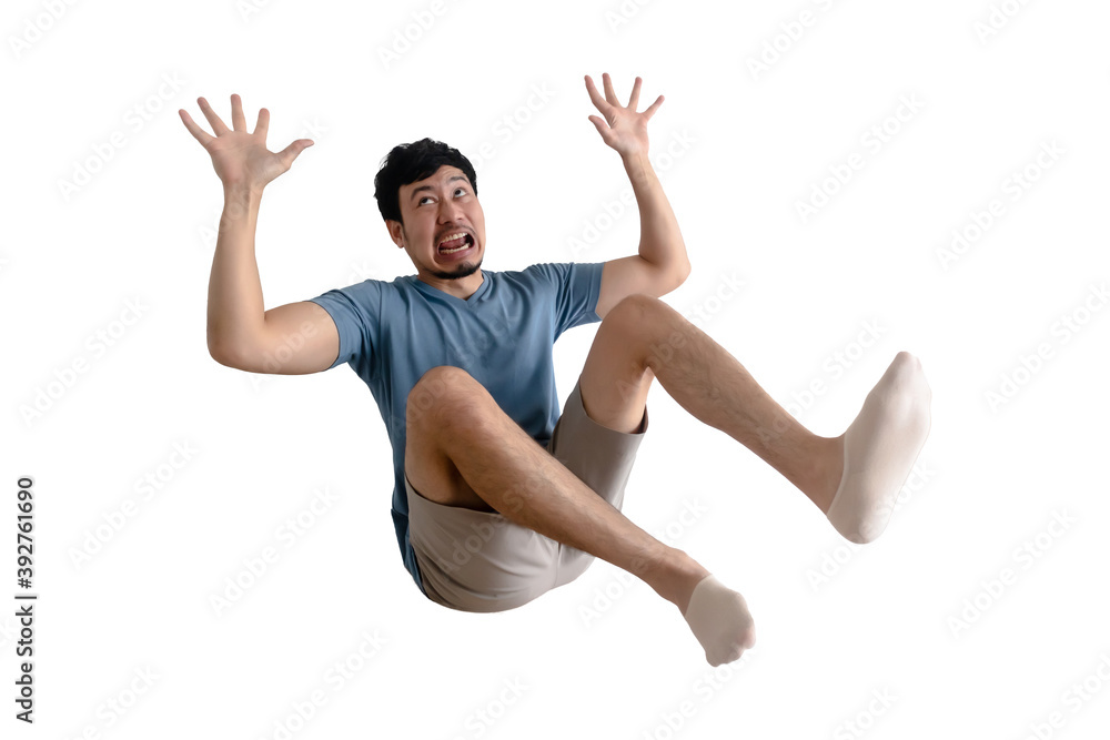 Funny full body of shocked Asian man being blown away on isolated background.