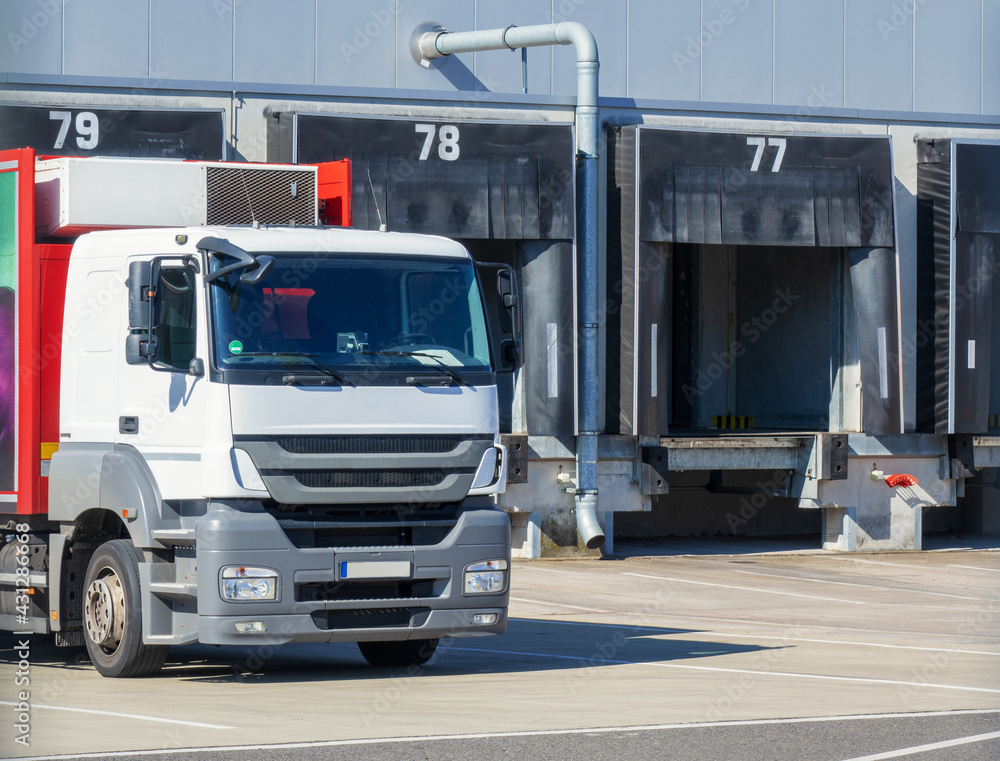 truck at loading ramps of a warehouse