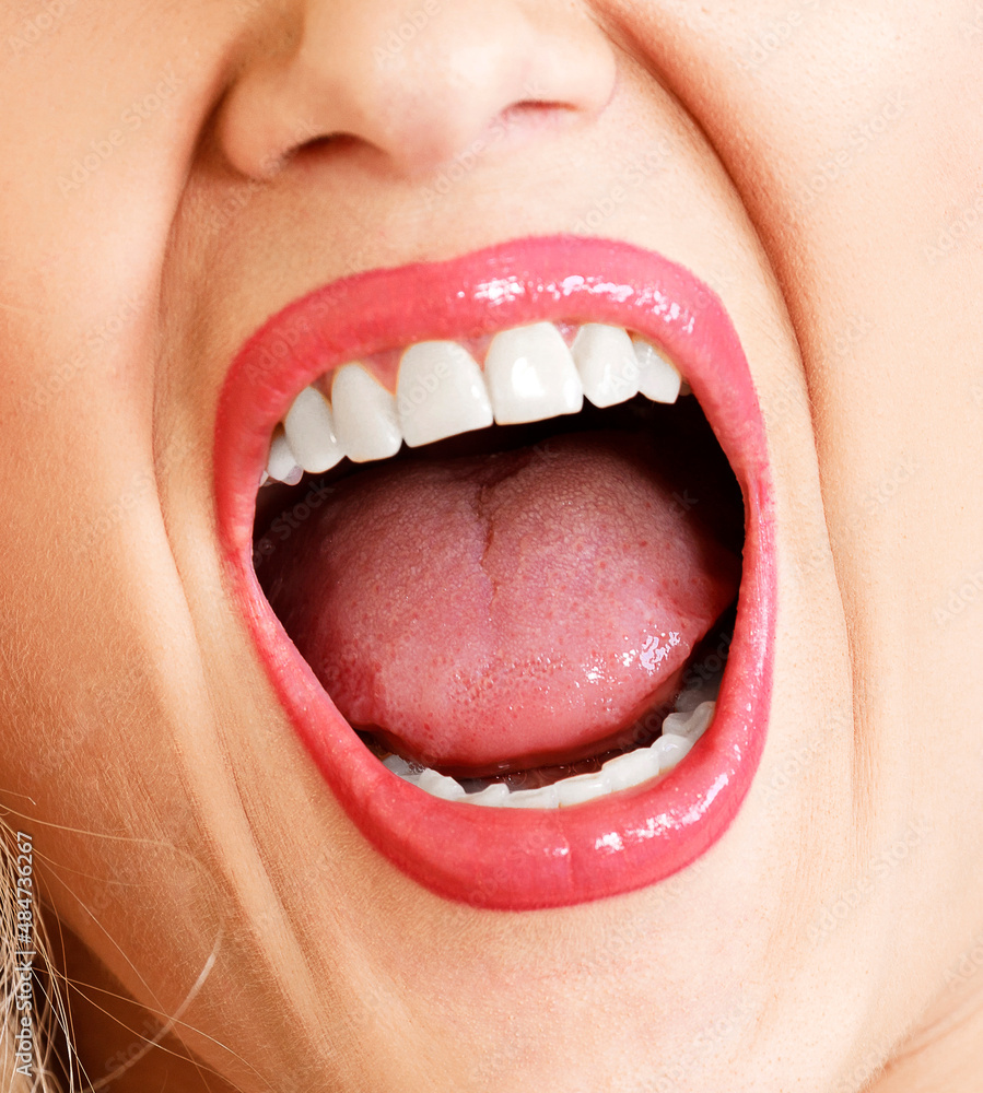 Open mouth of a woman, white healthy teeth