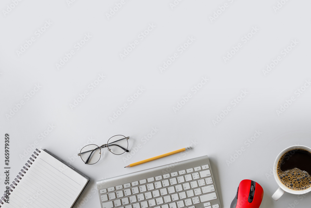 top view of office desk workspace with coffee cup and laptop on white table  background. flat lay Stock Photo | Adobe Stock