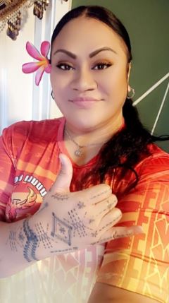 Tracy Sialega shows off her hand tattoos