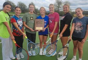 Members of the Mt. Pleasant girls tennis team, from left, Bella Fullman, Autumn Jurkovic-Kuzma, Kerstin O’Connor, Ella Alakson, Raleigh Drzal, Danica Turner and Hannah Shawley celebrate their regular-season section title Monday.