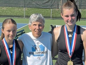 Quaker Valley tennis coach Christi Hays poses with freshman Avery Allan (left) and senior Kirsten Close at the WPIAL Class 2A doubles championships Oct. 3, 2024, at Bethel Park.