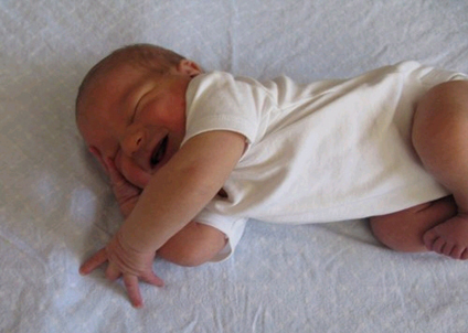 new born smiling while asleep