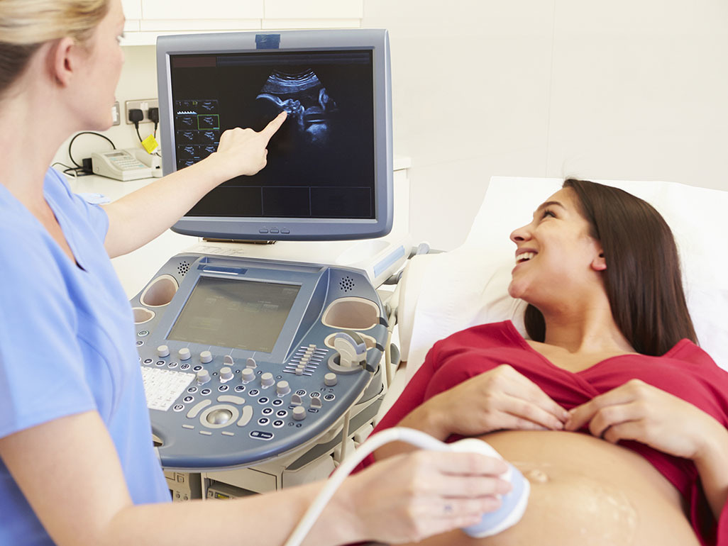 Pregnant woman at ultrasound scan