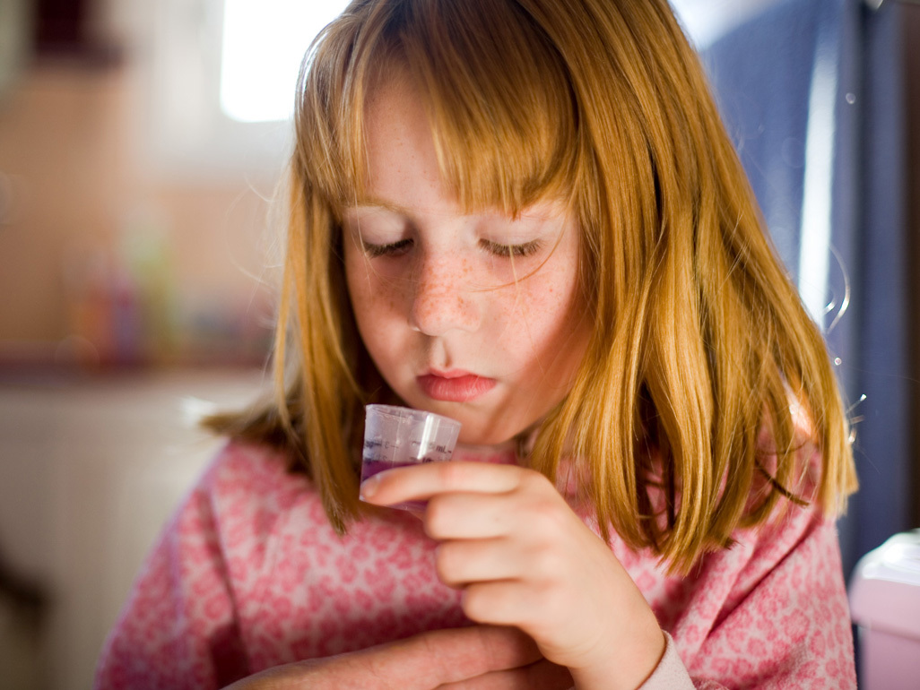 Child taking cough medication