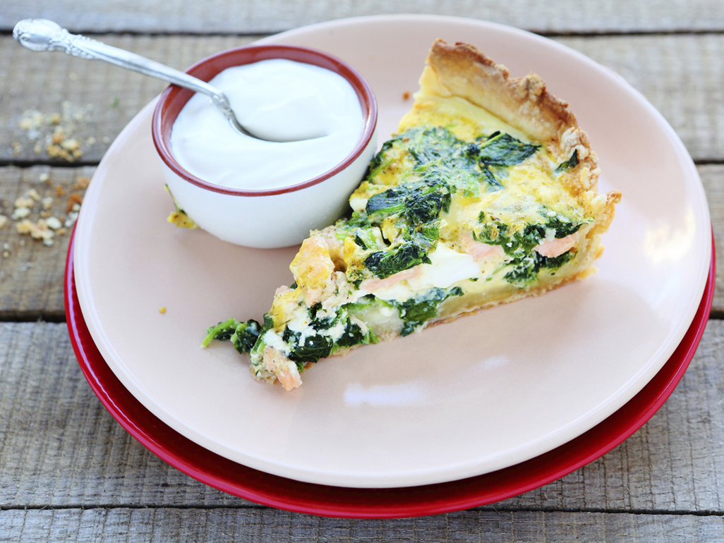 slice of spinach and cheese quiche