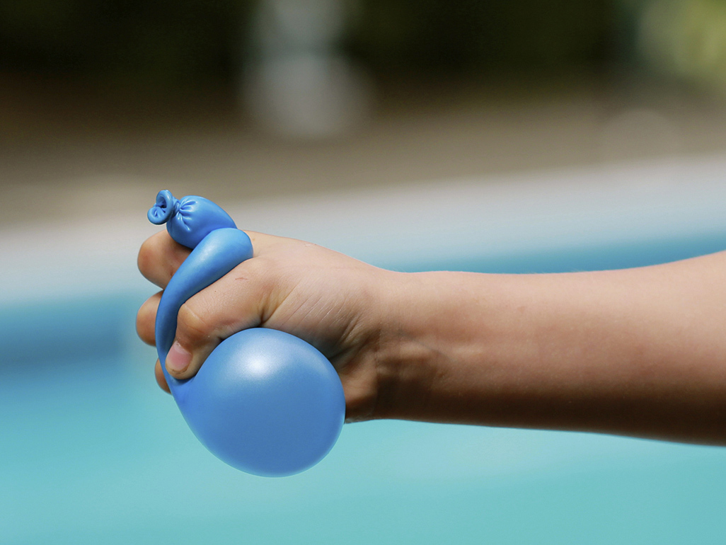 Water balloon being squeezed