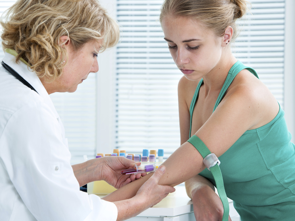 Pregnant woman having a blood test