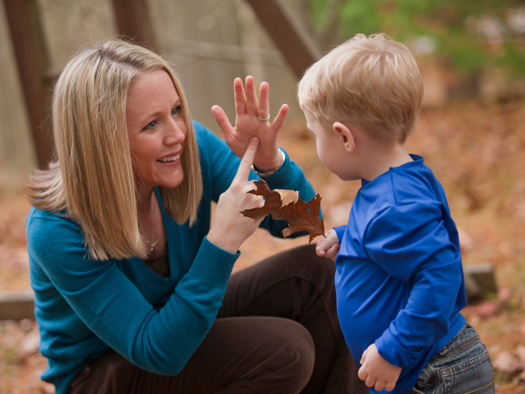 mother using sign language for baby