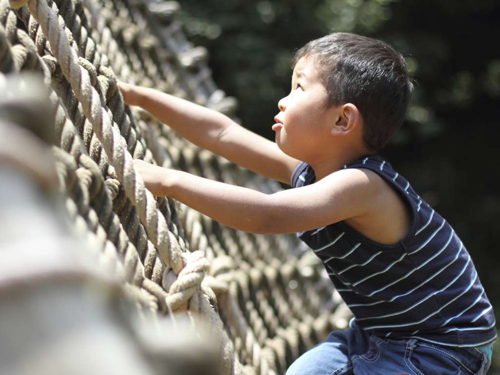 boy climbing rope