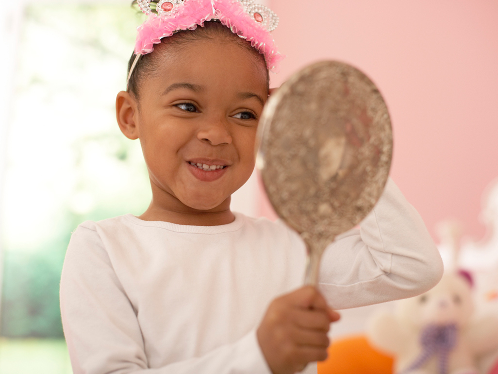 girl looking into the mirror