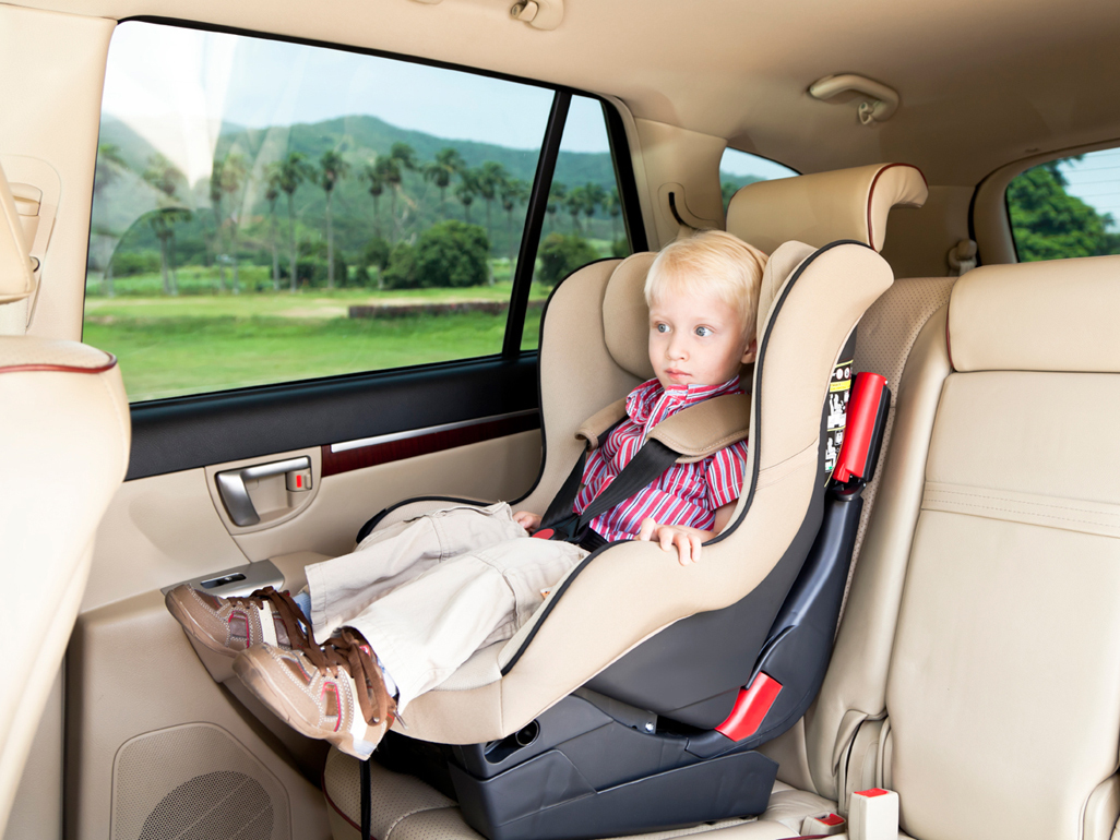 Toddler riding in car seat