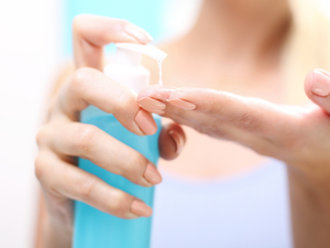 woman putting lubricant on her fingers