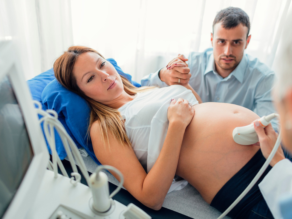 Couple in hospital room having a scan