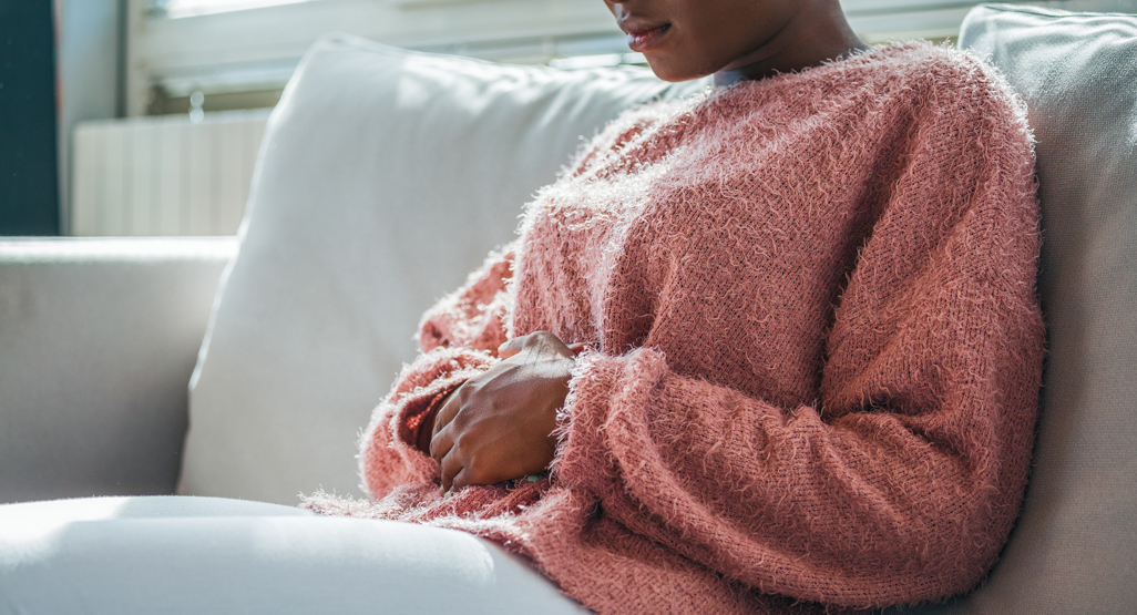 young woman holding her stomach