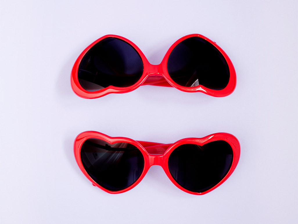 2 pairs of heart-shaped sunglasses