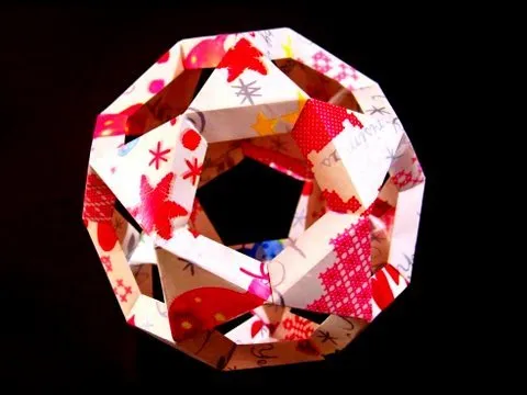 Colorful origami decoration in the shape of a twisted polyhedron.