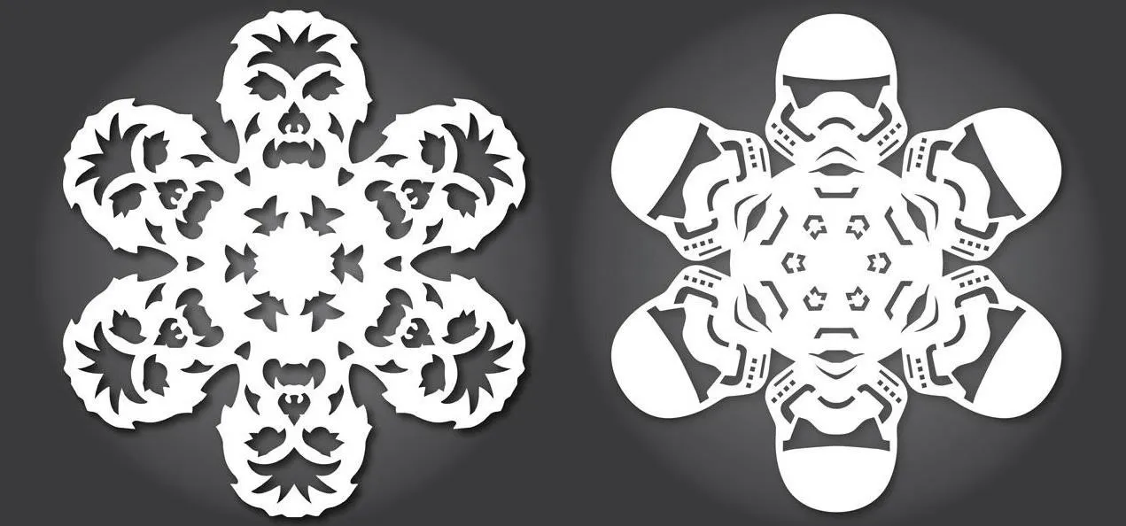 Star Wars themed paper snowflakes featuring iconic characters.