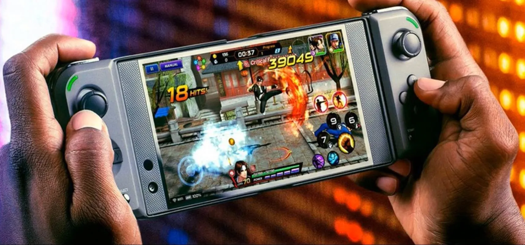 Person holding a handheld gaming device displaying a multiplayer game screen.