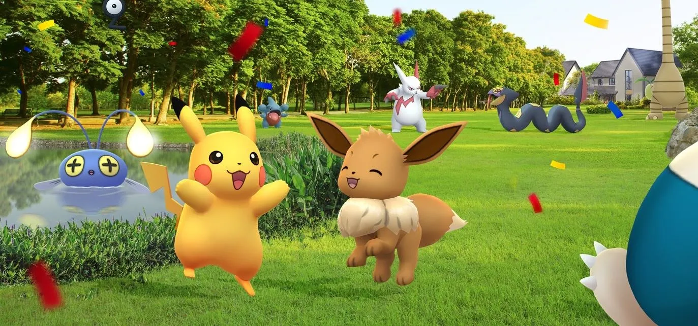 Pikachu and Eevee playing in a colorful outdoor setting with other Pokémon in the background.