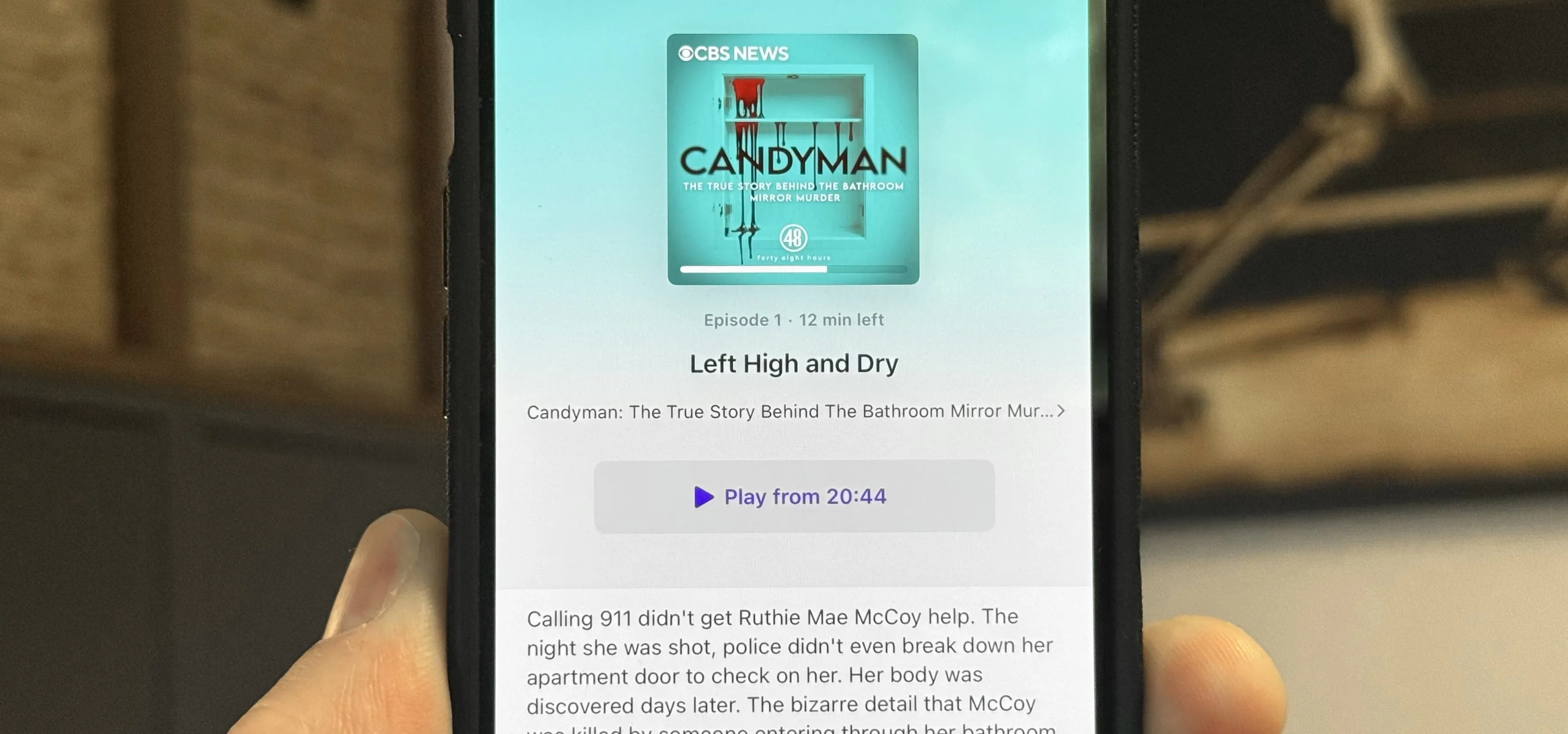 Image showing a mobile phone displaying the album cover for "Candyman" along with a play button and additional information about the album.