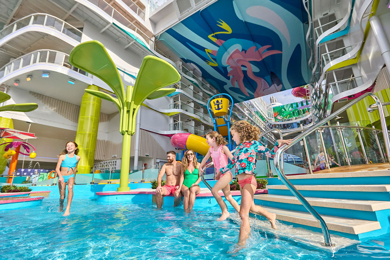 icon of the seas watersedge kids playing splashing family