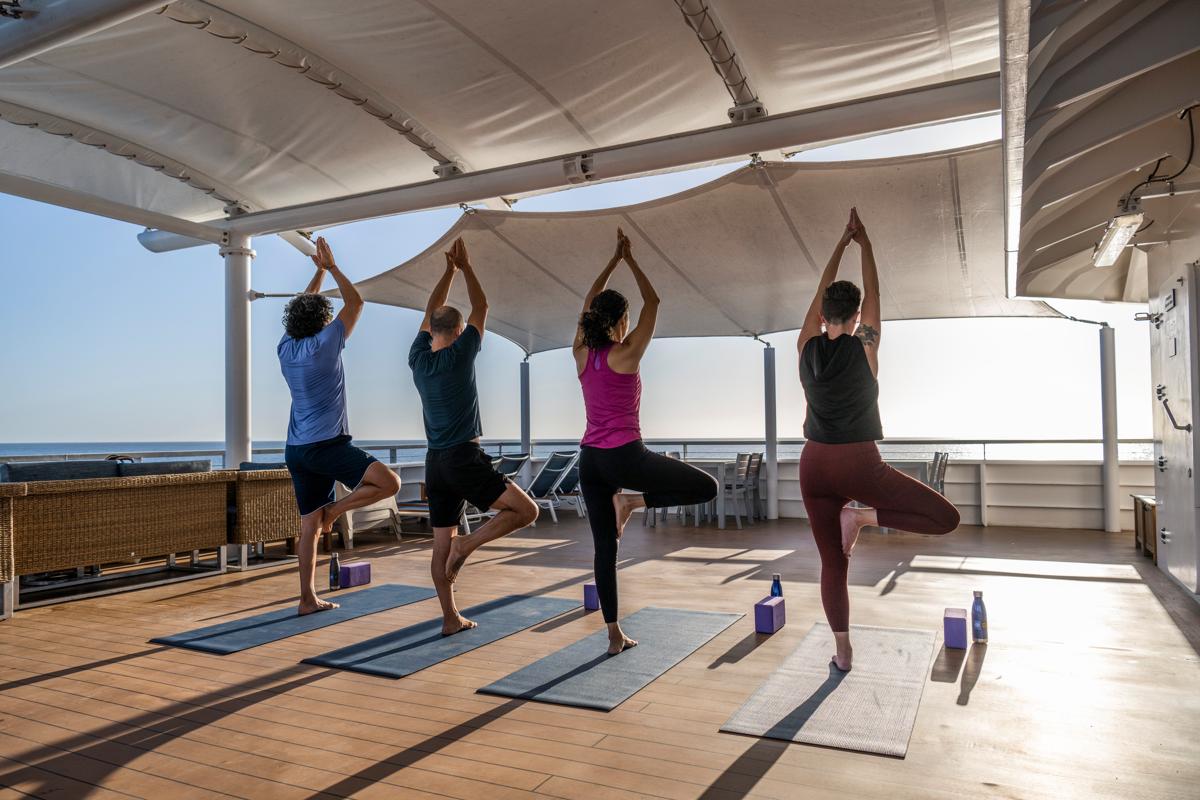 A yoga class taking place on the sundeck of the ship National Geographic Venture. Baja California