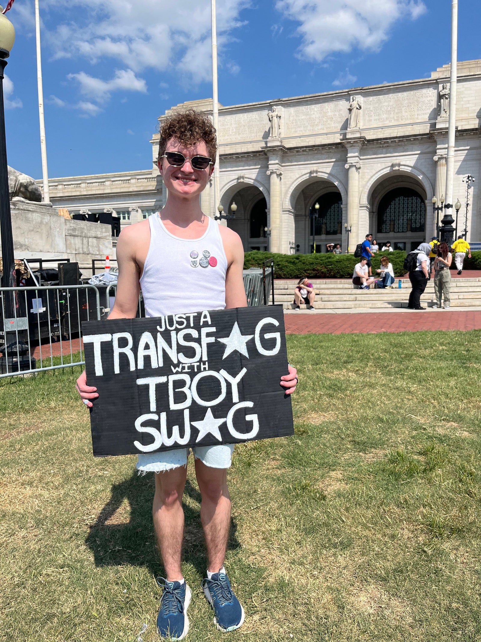 Finnick with a sign at the Gender Liberation March