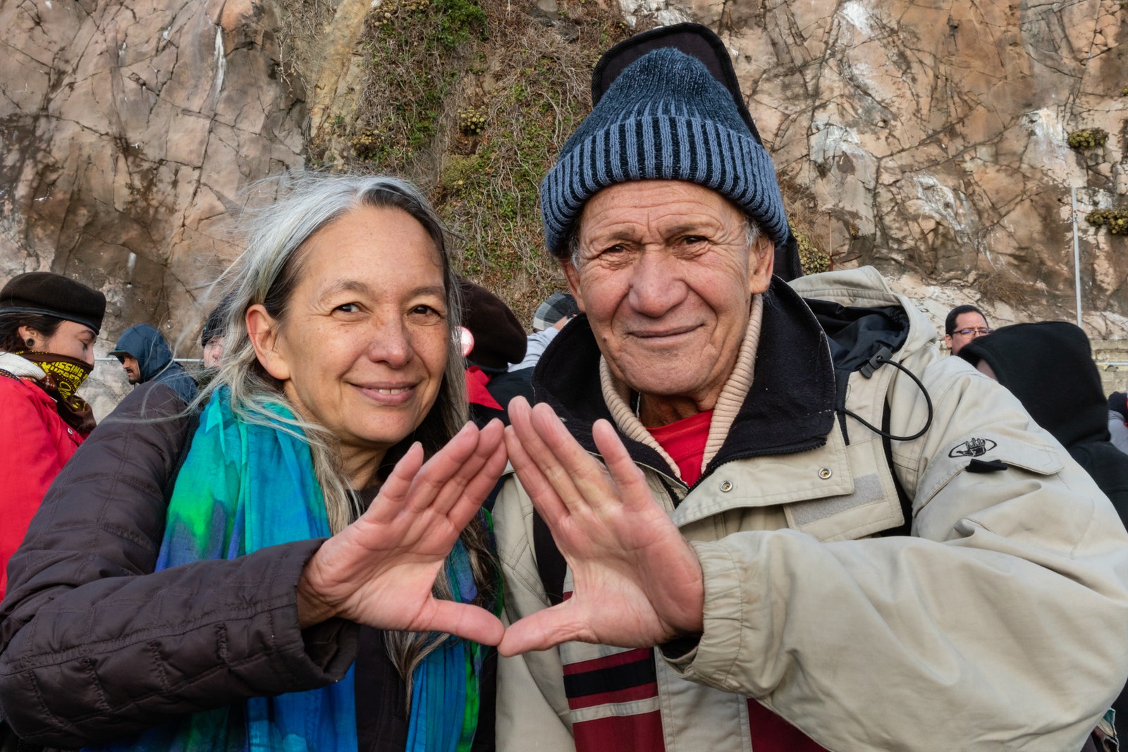 Liko Martin and Laulani Teale make the hand sign of solidarity  support of Mauna Kea protests at the Indigenous Peoples...