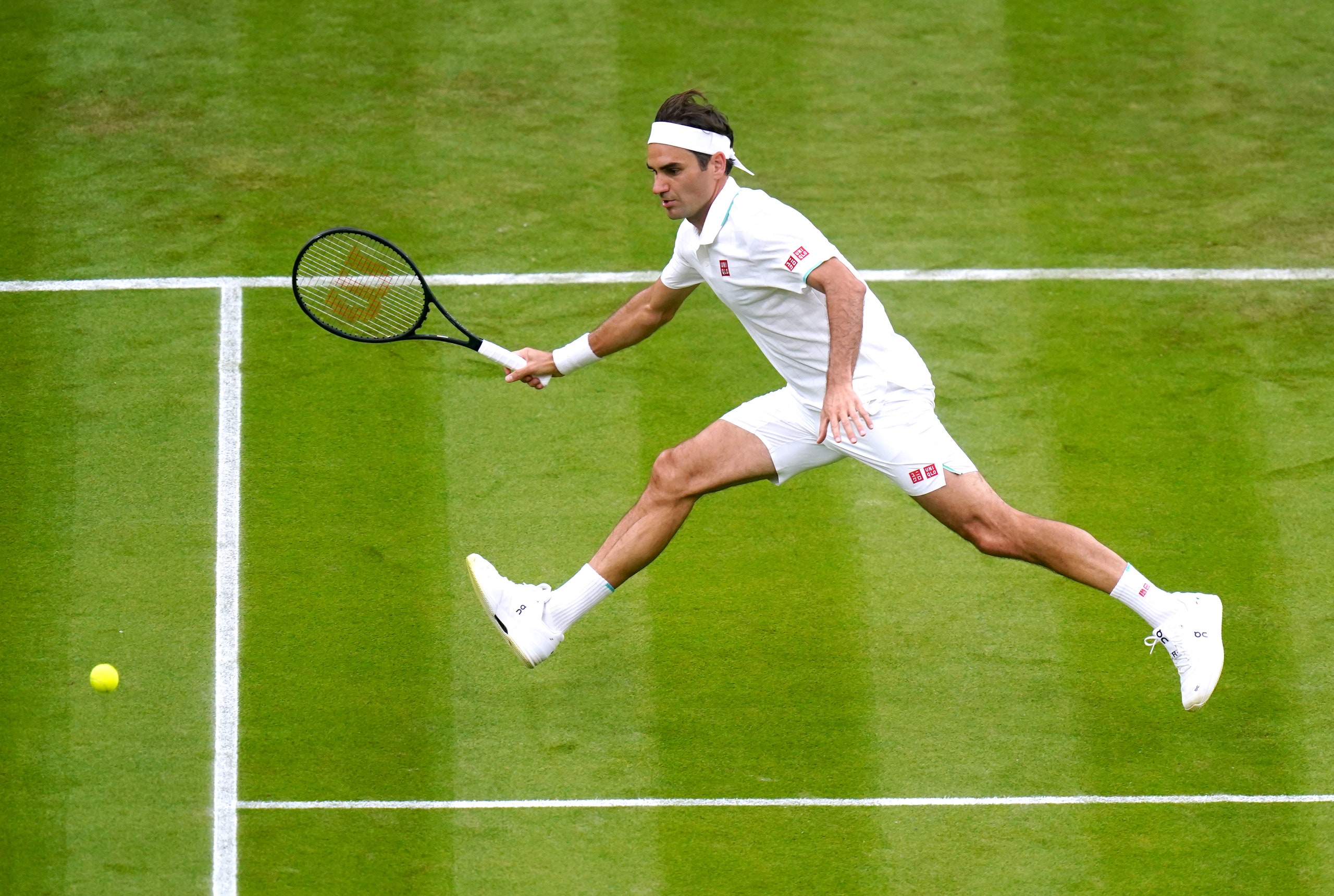 Image may contain Roger Federer Human Person Racket Tennis Racket Sport Sports Tennis and Tennis Court