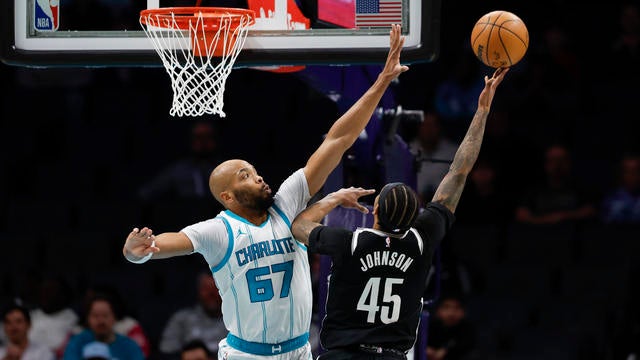 Brooklyn Nets guard Keon Johnson (45) shoots against Charlotte Hornets forward Taj Gibson during the first half of an NBA basketball game in Charlotte, N.C., Wednesday, Jan. 29, 2025. 