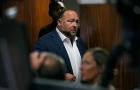 Alex Jones walks into the courtroom 