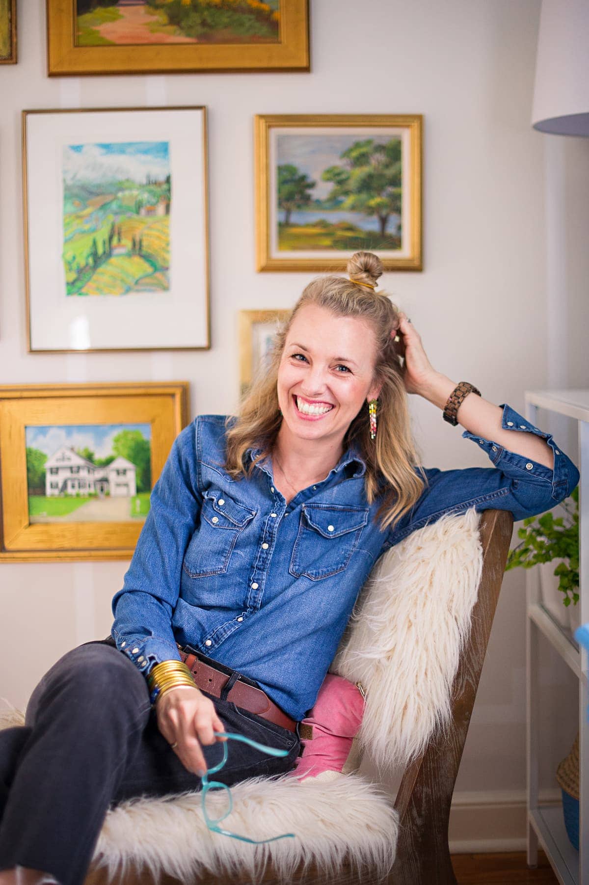 Charlotte sitting in chair smiling.