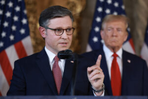 U.S. House Speaker Mike Johnson speaks as former President Donald Trump looks on at a press conference at Trump’s Mar-a-Lago club on April 12, 2024, in Palm Beach, Florida. Trump, who won November’s presidential election, endorsed Johnson to remain speaker Monday. (Photo by Joe Raedle/Getty Images)