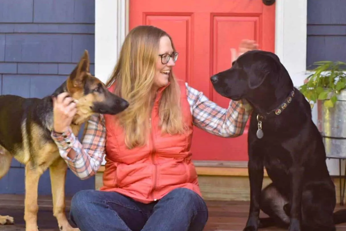 Tara Schatz sits with her two dogs, Gatsby and Flynn.