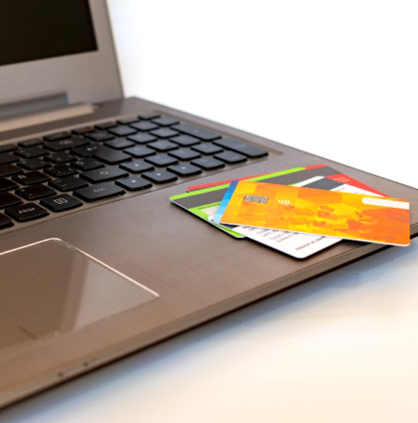 Laptop with credit cards on top