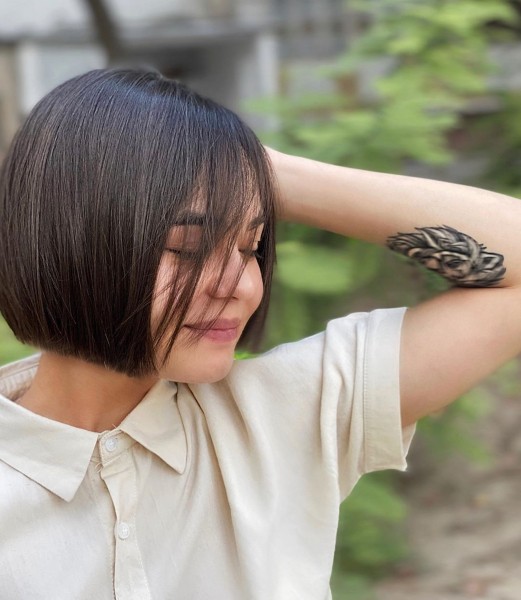 Chin-length bob hair cut.