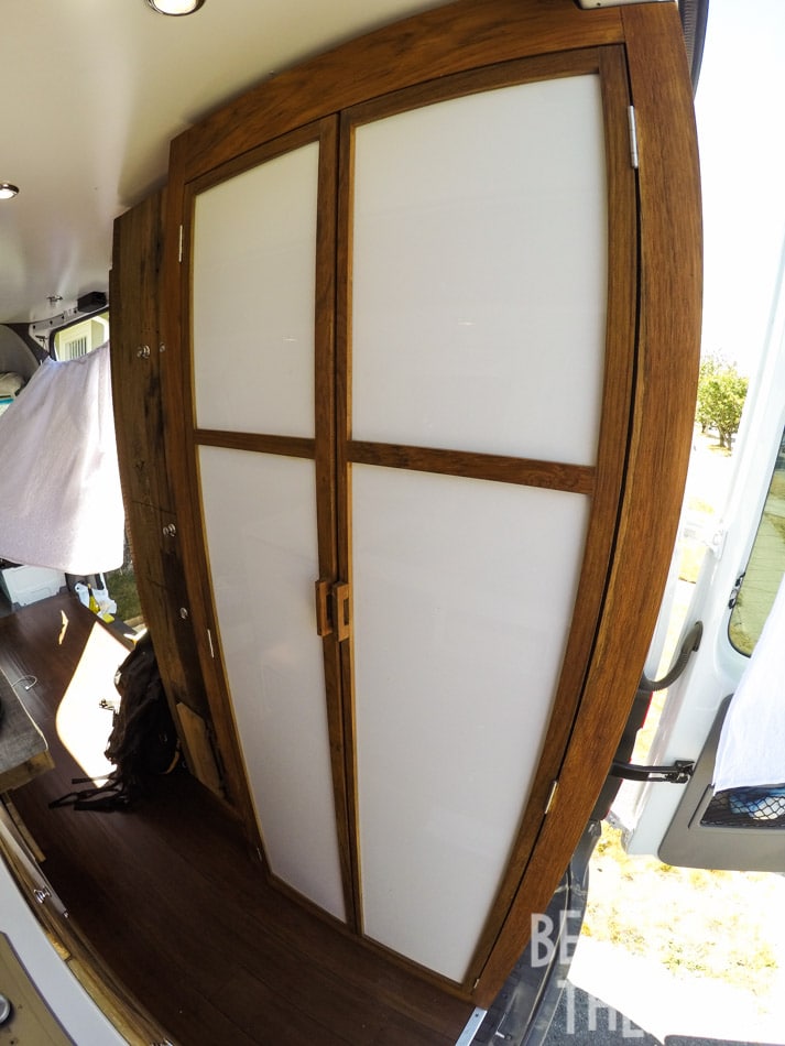 Floor to cieling custom bathroom with a shower and porta-potti in Kristen's first Mercedes sprinter camper van