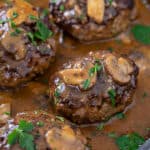 sailbury steak in pan smothered with mushroom gravy