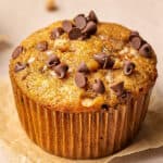 close up banana bread muffin topped with chocolate chips