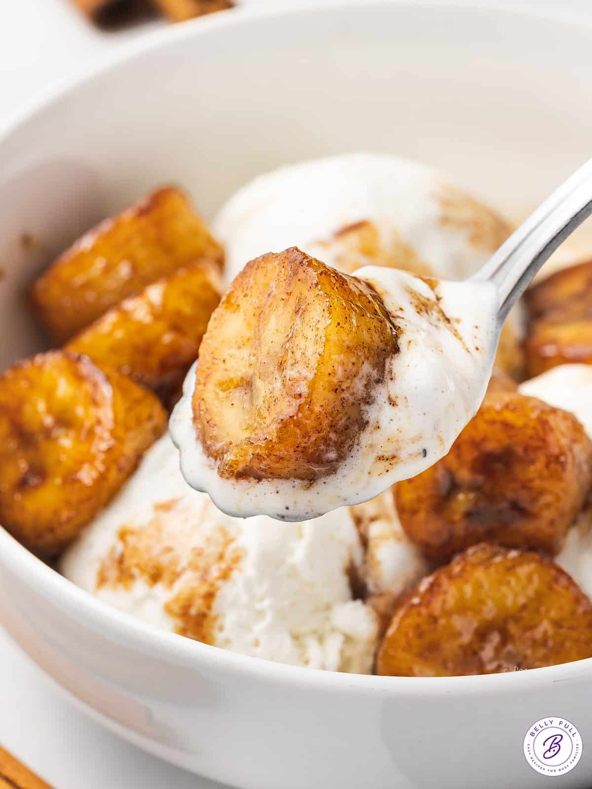 caramelized banana on spoon with ice cream