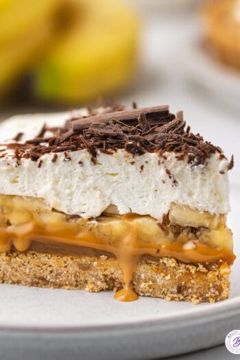 A slice of banoffee pie on a white plate