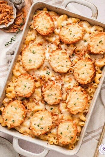 Overhead view of French onion mac and cheese in a baking dish.