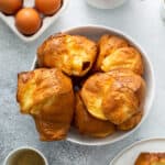 golden baked popovers piled in bowl