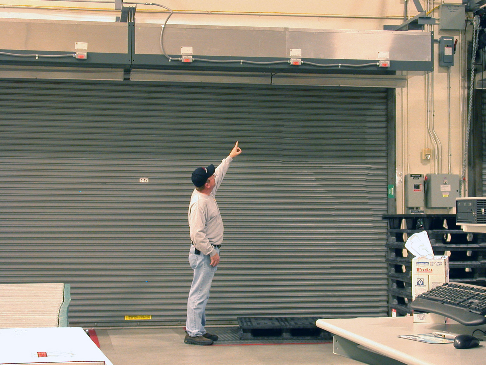 Berner's Industrial Direct Drive 12 air curtain over rollup doors at Yonkers Industries.