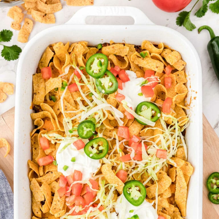 walking taco casserole in a white dish